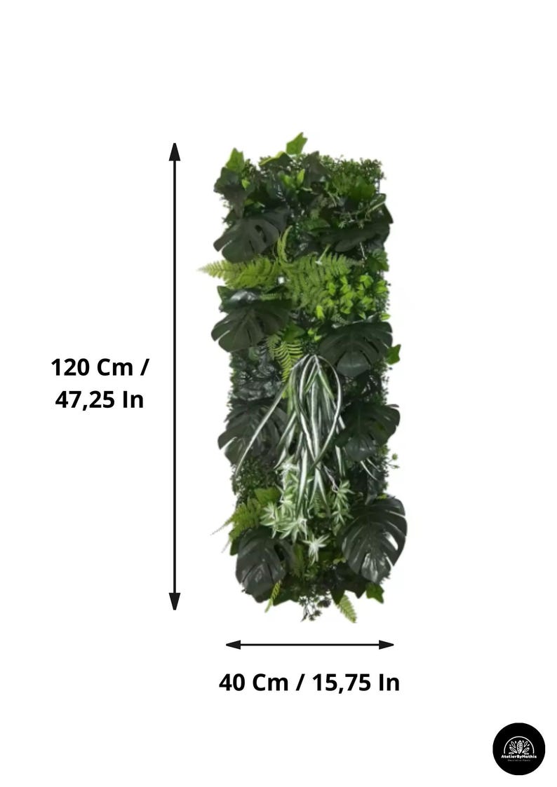 May include: Vertical artificial plant wall panel, 47.25 inches tall and 15.75 inches wide. The panel features a variety of green foliage, including large Monstera leaves, ferns, and other plant types. The panel is designed to mimic a natural green wall.