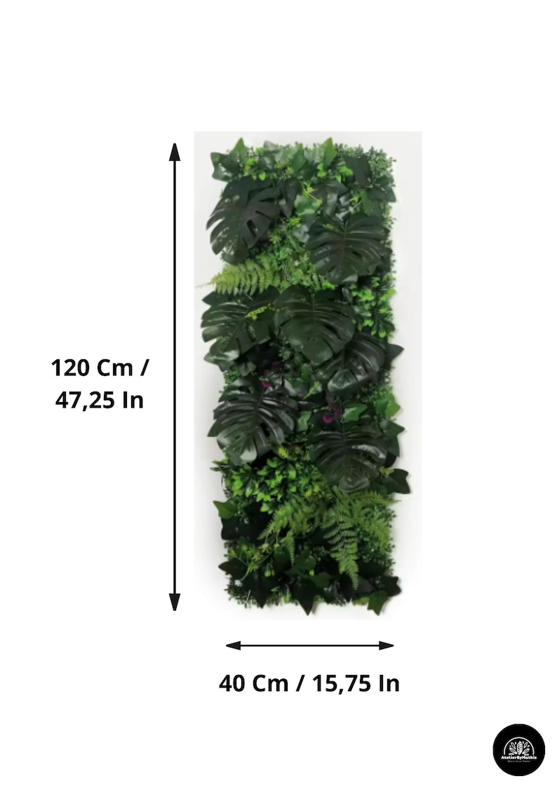 May include: Vertical artificial plant wall, 47.25 inches tall and 15.75 inches wide, featuring a variety of green foliage, including large, dark green monstera leaves and smaller ferns. The wall is designed to mimic a natural, lush environment.