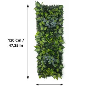 May include: A rectangular vertical wall decor piece filled with various shades of green artificial plants. The piece is 47.25 inches tall and 15.75 inches wide, offering a natural aesthetic. The design includes a mix of leaf shapes and textures.