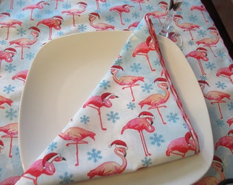 Christmas Flamingos  on blue wearing Santa hats  fabric napkins petit napkins and dinner napkins, Dessert napkins