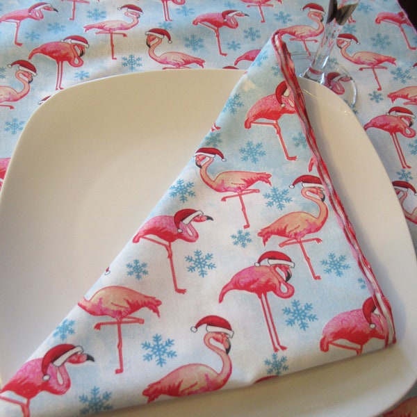 Christmas Flamingos  on blue wearing Santa hats  fabric napkins petit napkins and dinner napkins, Dessert napkins