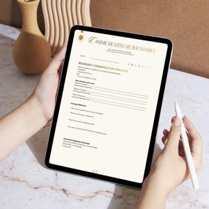 May include: A digital tablet displaying a "Communicating My Boundaries" worksheet. The worksheet includes prompts for boundary communication practice, courage reflection, and emotional regulation. A stylus is held in the hand, ready to write on the screen.