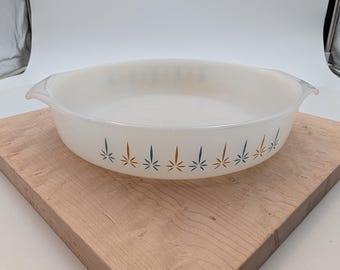 Fire-King # 429  9 inch round baking pan featuring the "candle glow" atomic starburst pattern.