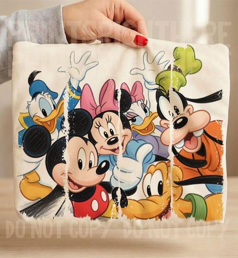 May include: A cream-colored tote bag featuring a colorful graphic of Disney cartoon characters, including Mickey Mouse, Minnie Mouse, Donald Duck, Daisy Duck, and Goofy. The image has a distressed, vintage look.