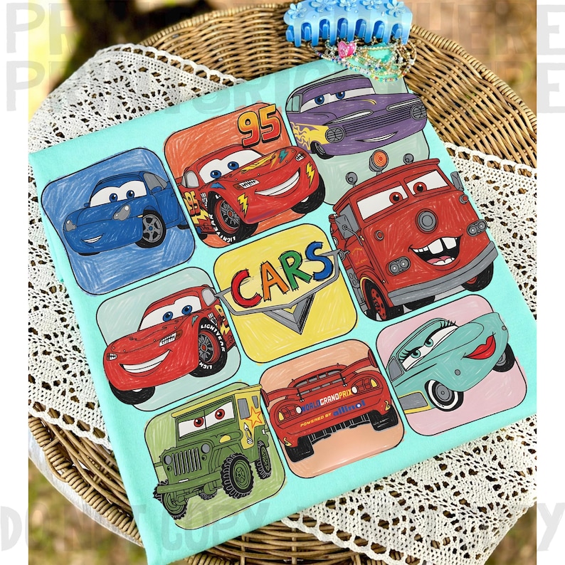 May include: A light blue Cars-themed fabric featuring cartoon car illustrations in various colors. The design includes Lightning McQueen, Mater, and other characters from the animated movie. The word "CARS" is prominently displayed.