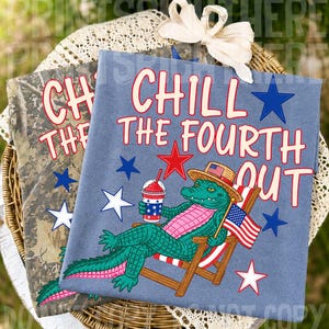 May include: Two t-shirts with patriotic designs. One is a blue shirt with a cartoon alligator in a beach chair, holding a drink and an American flag, with the text "CHILL THE FOURTH OUT." The other shirt is camouflage with the text "CHILL THE".