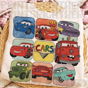 May include: White sweatshirt featuring colorful cartoon car illustrations. The design includes various car characters in square frames, with the word "CARS" in a central logo. The overall style is reminiscent of a children's drawing.