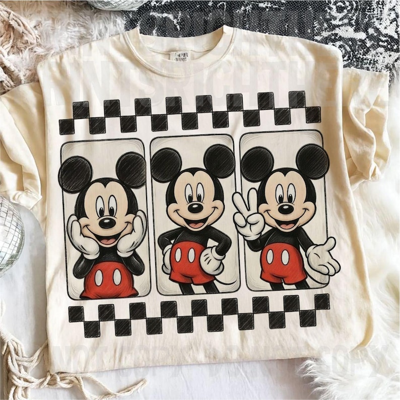 May include: Cream-colored t-shirt featuring three panels with Mickey Mouse illustrations. Each panel shows Mickey in a different pose, with a black and white checkered border above and below the panels. Mickey is wearing red shorts and white gloves.