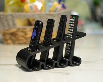Soporte para mando a distancia con diseño ondulado