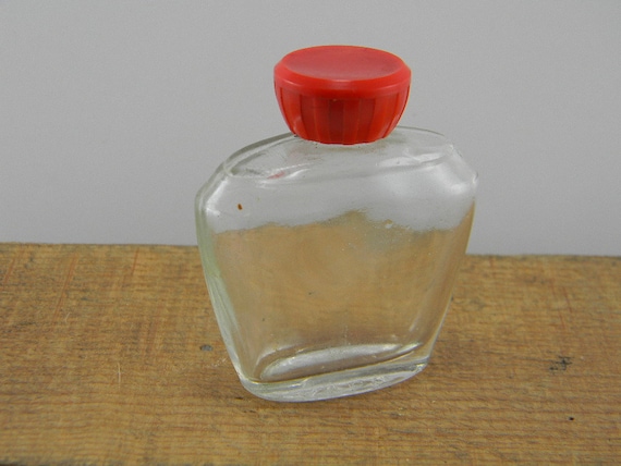 Avon perfume glass bottle with red cap Avon perfume glass bottle with red cap