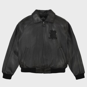 May include: Black leather bomber jacket with a collar, zipper closure, and a patch on the chest. The jacket has a ribbed hem and cuffs. The brand name is visible on the collar.