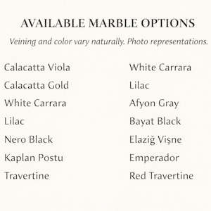 May include: A list of available marble options, including Calacatta Viola, White Carrara, and Lilac, is displayed on a cream-colored background. The text "AVAILABLE MARBLE OPTIONS" is at the top, with a note about natural veining and color variations.