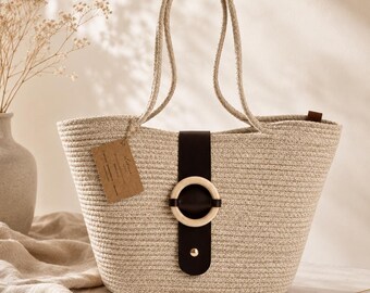 Beige Woven Tote Bag with Brown Strap and Wooden Ring Detail