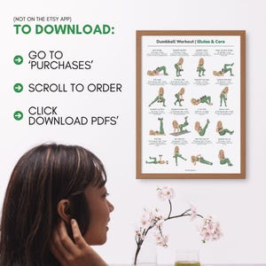 May include: A framed print titled "Dumbbell Workout | Glutes & Core" with illustrations of exercises. The print is in a wooden frame. Text on the left side says "TO DOWNLOAD: GO TO 'PURCHASES', SCROLL TO ORDER, CLICK DOWNLOAD PDFS'".