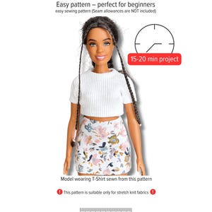 May include: A doll wearing a white crop top and a floral print skirt. The image includes text that reads "Model No. 004 - Basic T-Shirt Curvy Dolls" and "15-20 min project." The pattern is suitable for stretch knit fabrics.