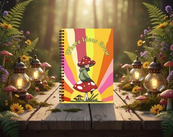 Puede incluir: Un cuaderno de espiral con un gráfico colorido de una persona sentada sobre una seta grande roja con puntos blancos. El fondo tiene rayos de sol amarillos, naranjas y rosas con el texto Where Ideas Grow impreso en la parte superior.