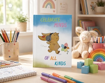 Puede incluir: Un libro de tapa dura con una cubierta en degradado azul claro y blanco que muestra un conejo marrón de dibujos animados con auriculares negros caminando hacia una flor colorida. El texto dice CELEBRATE MINDS OF ALL KINDS en amarillo, rosa, morado y azul.