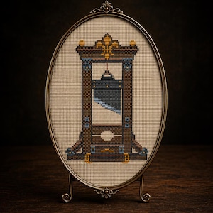 May include: An oval-framed cross-stitch embroidery depicting a brown wooden guillotine with a dark gray blade, gold fleur-de-lis accents, and light blue detailing, set against a cream-colored fabric background within a decorative metallic frame.