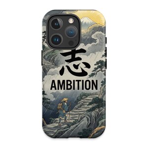 May include: A phone case featuring a Japanese-style illustration of a person climbing a mountain path in the rain. The design includes the word "AMBITION" and Japanese characters. The background shows a mountain and cloudy sky.