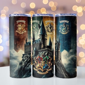 May include: Three stainless steel tumblers featuring designs from the Harry Potter series. Each tumbler displays a different Hogwarts house crest: Gryffindor, Slytherin, Hufflepuff, and Ravenclaw. The tumblers have a dark, vintage aesthetic with a castle illustration.