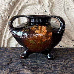 May include: A rustic wooden sign with the text "Welcome to our home" in white lettering. The sign features a distressed finish and a simple, inviting design, perfect for entryway decor.