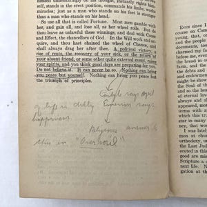 May include: A page from a vintage book with text about fortune and the soul. The text is highlighted with handwritten notes that say "Carlyle says so!" and "Experience says." The handwritten notes also say "Life in charity" and "Happiness" and "Religious answer to this in "Our Soul""