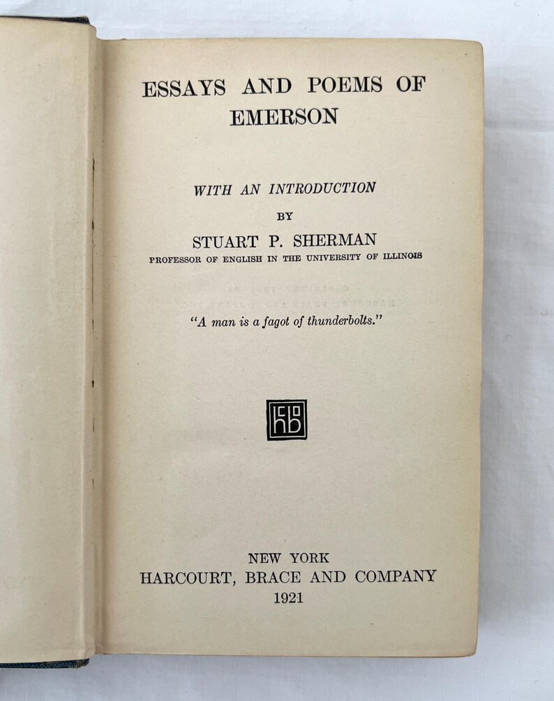 May include: A vintage book cover with the title "Essays and Poems of Emerson" by Stuart P. Sherman, Professor of English in the University of Illinois. The book was published in 1921 by Harcourt, Brace and Company in New York.
