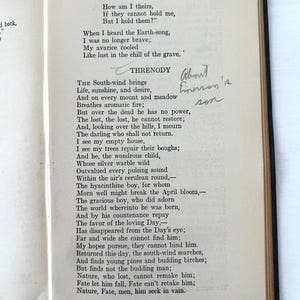 May include: A page from a book of poems by Ralph Waldo Emerson. The poem is titled "Threnody" and is about the death of a child. The text is printed in black ink on white paper. The page is slightly yellowed with age. There is a handwritten note in the margin that says "About Emerson's son".