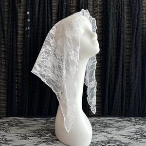 white lace triangular bandana head-neck scarf, mantilla, veil.