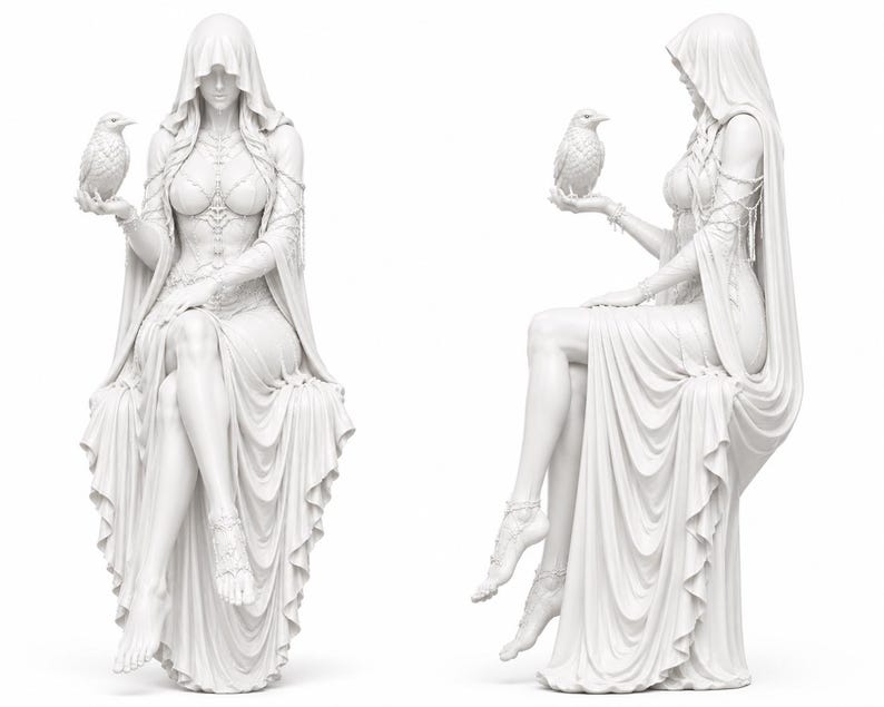 May include: A white monochromatic statue depicting a hooded figure in a flowing gown, seated with legs crossed. The figure wears intricate bodice detailing and delicate chains, holding a small bird in one hand. The sculpture is shown from two angles.