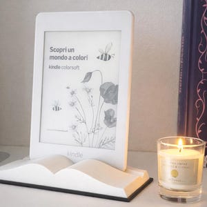 May include: A set of three ceramic mugs with a speckled, matte finish. The mugs are in shades of cream, light gray, and dark gray. Each mug has a simple, minimalist design and a rounded handle. The mugs are likely for coffee or tea.