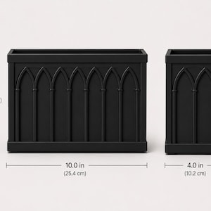 May include: Two matte black rectangular planters featuring a raised gothic arch pattern on the front. The larger planter measures 10.0 inches wide by 7.0 inches high, while the smaller square planter measures 4.0 inches wide by 7.0 inches high.