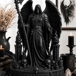 May include: A black statue of Thanatos, the Greek personification of death, with a scythe and large wings. The statue features a hooded figure with a skeletal face, surrounded by skulls and flames. The base of the statue is inscribed with the name "THANATOS".