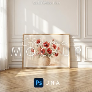 May include: A framed floral print featuring a watercolor painting of red poppies in a vase. The artwork is displayed on a wooden floor against a white wall. The words "Frame Mock Up" are written on the artwork.