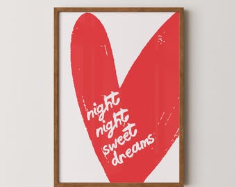 May include: A framed print featuring a large red heart shape with the words "night night sweet dreams" in white script. The artwork is set against a white background, framed in a brown wooden frame.