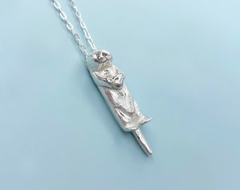 Sterling Silver Otter Necklace Holding a Tiny Clam Shell