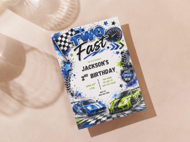 May include: A rectangular birthday invitation card featuring the text TWO FAST, Jackson's 2nd Birthday, and event details. The design includes a blue and green race car, a checkered flag, tire tracks, stars, and a speedometer on a white background.