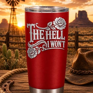May include: A red stainless steel tumbler with a clear lid, featuring a white engraved design of two roses and the text "THE HELL I WON'T" in a decorative font. The tumbler has a metallic silver base and a textured matte red finish.