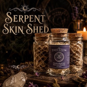 May include: Three clear glass jars with cork stoppers filled with textured, light-coloured serpent skin shed. The central jar features a purple label with the text Etheric Sanctum, Premium Selection, and 1oz volume, alongside a circular logo.