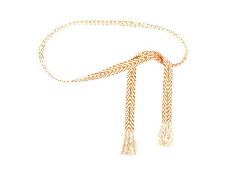 May include: A woven orange and white belt with tassels. The belt is tied in a knot and has a chevron pattern.