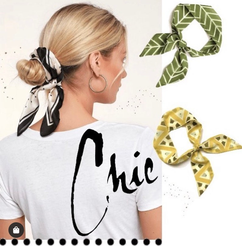 May include: A woman with blonde hair is wearing a white t-shirt with the word "Chic" written in black script. She is wearing a black and white patterned scarf tied around her hair. Two patterned scarves are shown in the background, one green and one yellow.