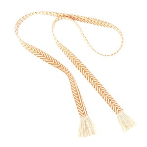 May include: A long, thin, woven cord with a chevron pattern in brown and white. The cord has tassels at each end.