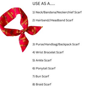 May include: A red scarf with a repeating pattern of brown footballs and the yellow text GO CHIEFS!. The text USE AS A..... 1) Neck/Bandana/Neckerchief Scarf 2) Hairband//Headband Scarf 3) Purse/Handbag/Backpack Scarf 4) Wrist Bracelet Scarf 5) Ankle Scarf 6) Ponytail Scarf 7) Bun Scarf 8) Braid Scarf is printed in black.