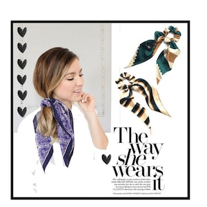 May include: Two silk hair scrunchies with a green and gold striped pattern and a brown and green striped pattern. The text "The way she wears it" is printed below the scrunchies.