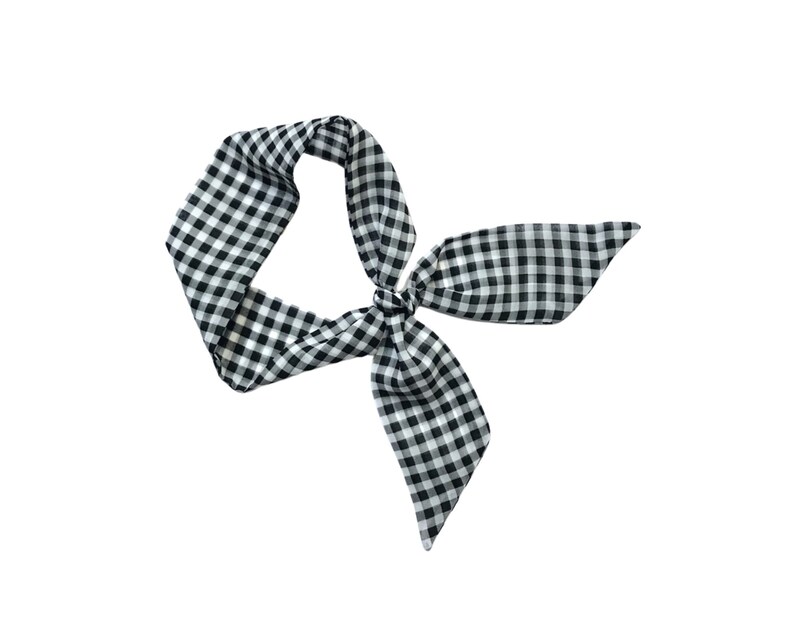 May include: A black and white gingham hair scarf tied in a bow.