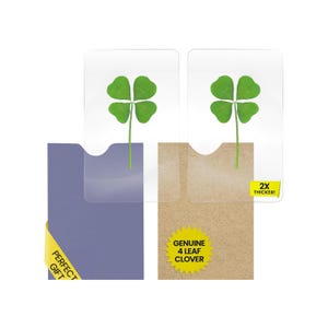 May include: Two genuine four-leaf clovers encased in clear plastic, presented in a purple and a brown card. The brown card has a yellow sticker that says "2X THICKER!" and "GENUINE 4 LEAF CLOVER". The purple card has a yellow sticker that says "PERFECT GIFT".