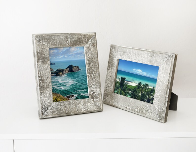 May include: Two rustic wood picture frames with a whitewashed finish. The frames are empty and ready to display photos.