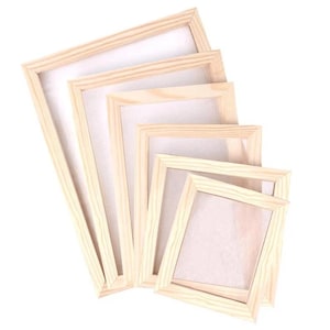May include: A set of five rectangular picture frames made of light-colored natural wood, arranged in a cascading stack from largest to smallest. Each frame features a simple, clean-lined border and a white backing, showcasing a uniform design.
