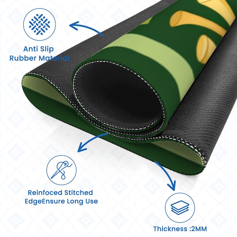 Peut inclure: Tapis de souris vert et jaune enroul&eacute;, avec une base en caoutchouc antid&eacute;rapant noir. Le tapis de souris pr&eacute;sente des bords cousus renforc&eacute;s pour la durabilit&eacute; et une &eacute;paisseur de 2 mm. Le texte "Anti Slip Rubber Material" est visible.