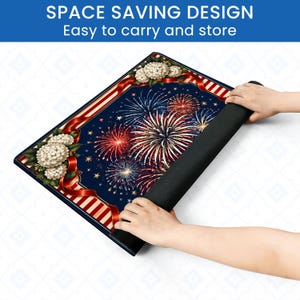 May include: A rectangular mat with a patriotic design featuring fireworks, red and white stripes, and white flowers. The mat is dark blue with a black rolled-up section, and the text "SPACE SAVING DESIGN Easy to carry and store" is visible.